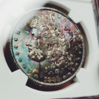 1883-CC Rainbow Toned Morgan Silver Dollar MS64 